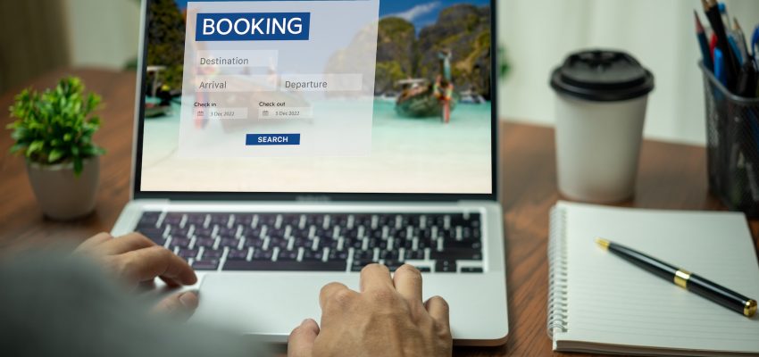 Online booking platform on a laptop computer by a person